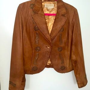 Tan leather jacket with metal